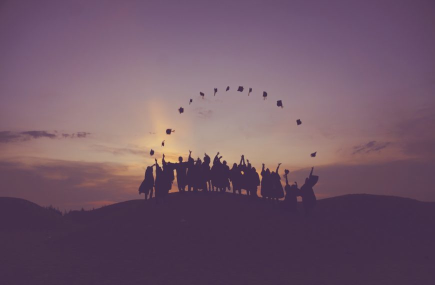 The picture shows graduates throwing their hats to represent the future of higher ed and finance teams.