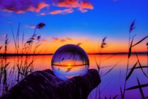 The picture shows a crystal ball to represent predictions for 2023 in higher ed.