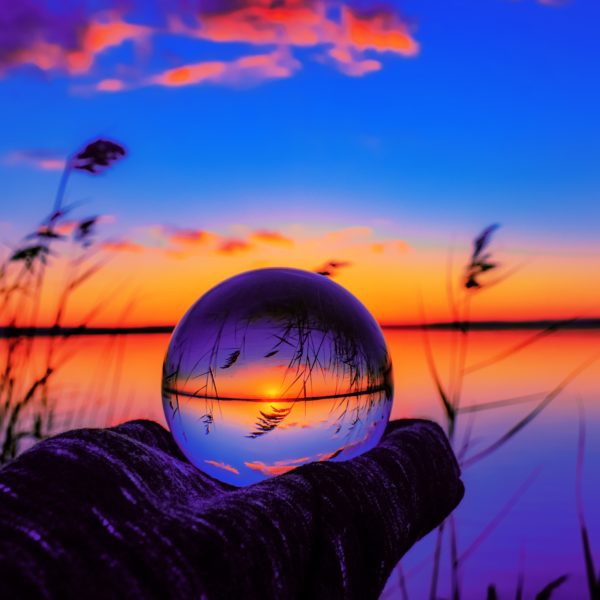 The picture shows a crystal ball to represent predictions for 2023 in higher ed.
