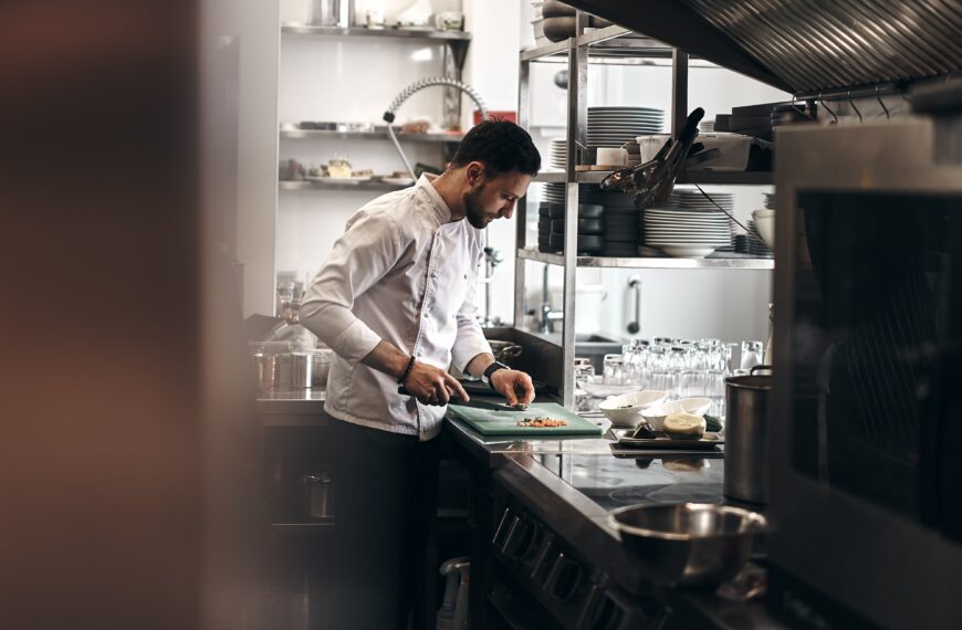 The picture is of a chef preparing food. The article is about higher ed learning from a chef.