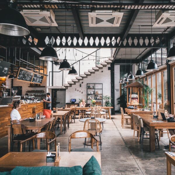 The picture shows a nearly empty restaurant to represent the value of analyzing course offerings to adapt to enrollment declines.