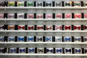 The picture shows a large display of different colored bowties, to represent making decisions based on metrics.